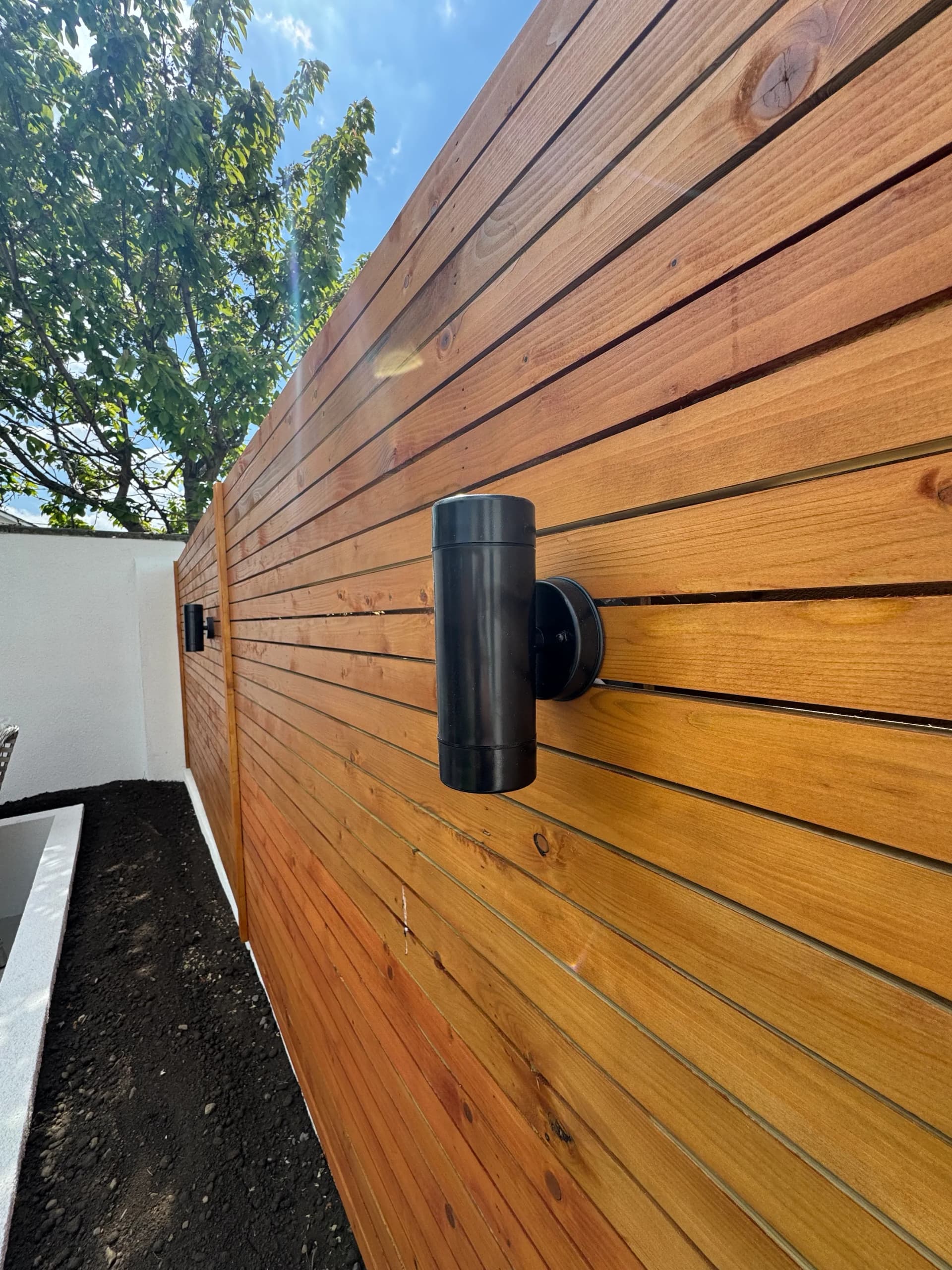 Timber gate and pergola structure leading to a side passage