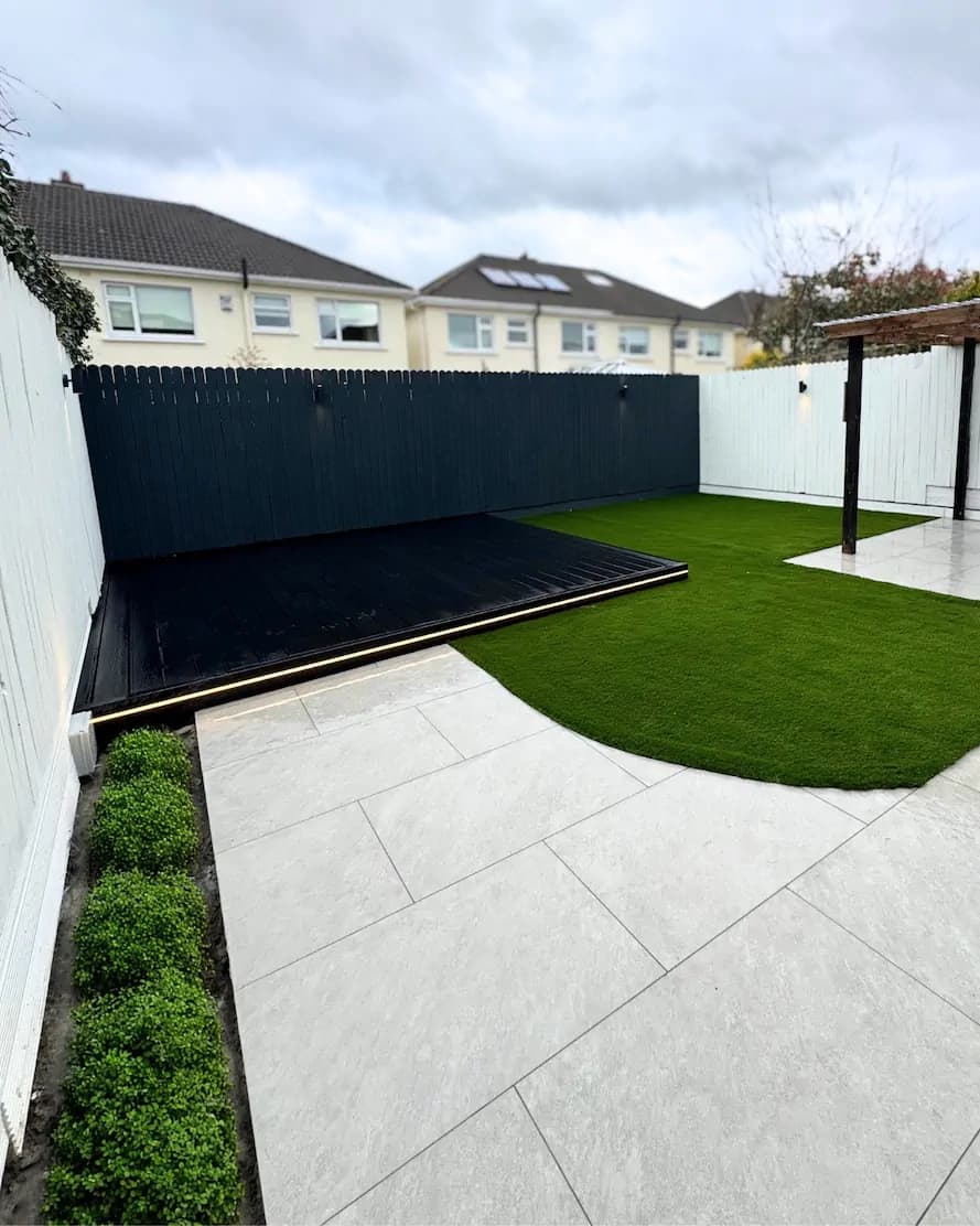 Timber fence with wall light in a modern Dublin garden