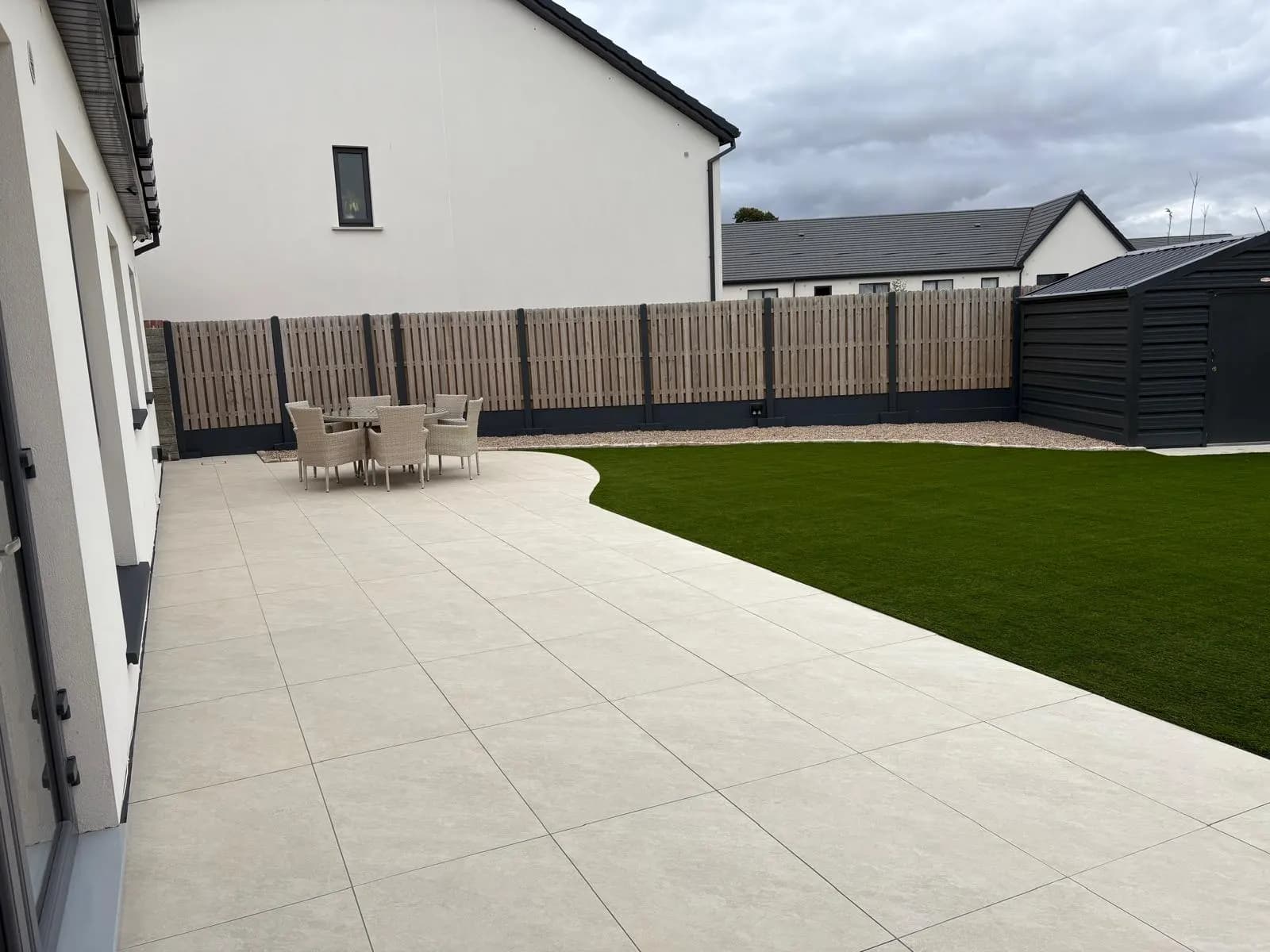 Low-maintenance new build garden in Dublin with porcelain patio and artificial lawn