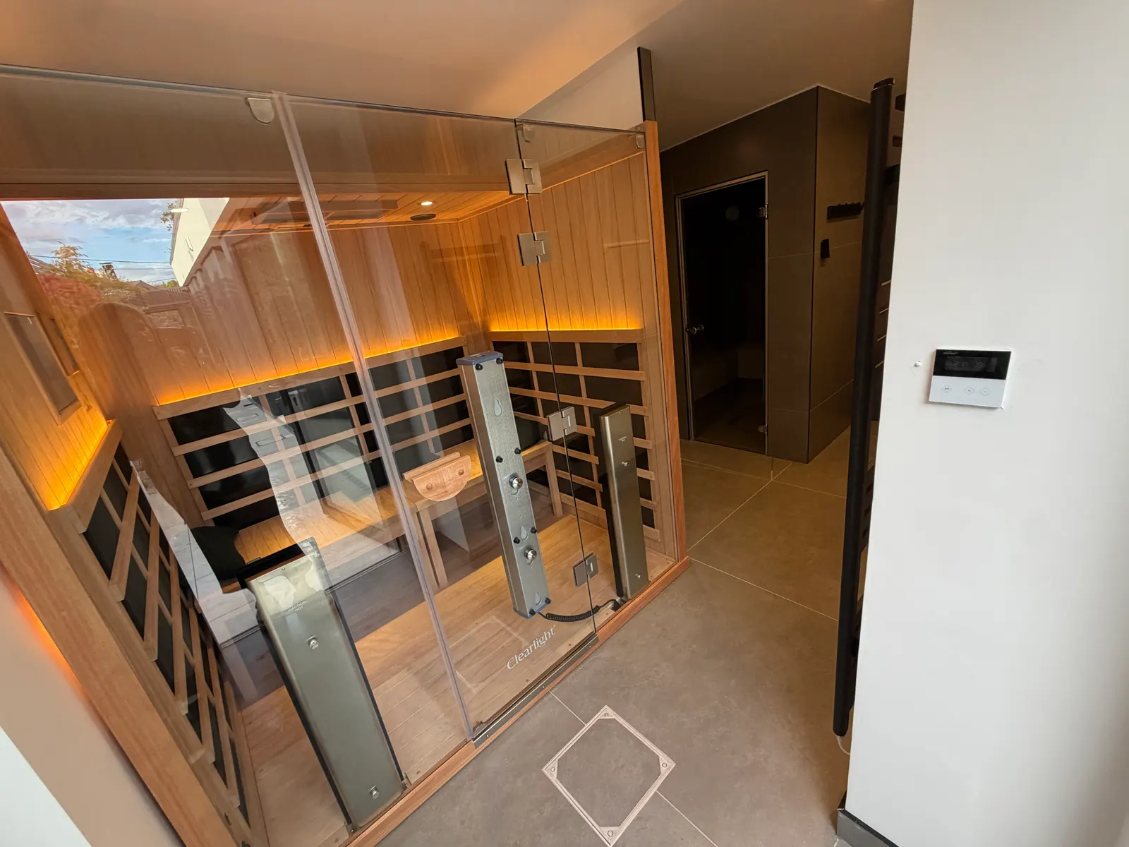 Infrared sauna with cedar interior inside a garden wellness room in Dublin