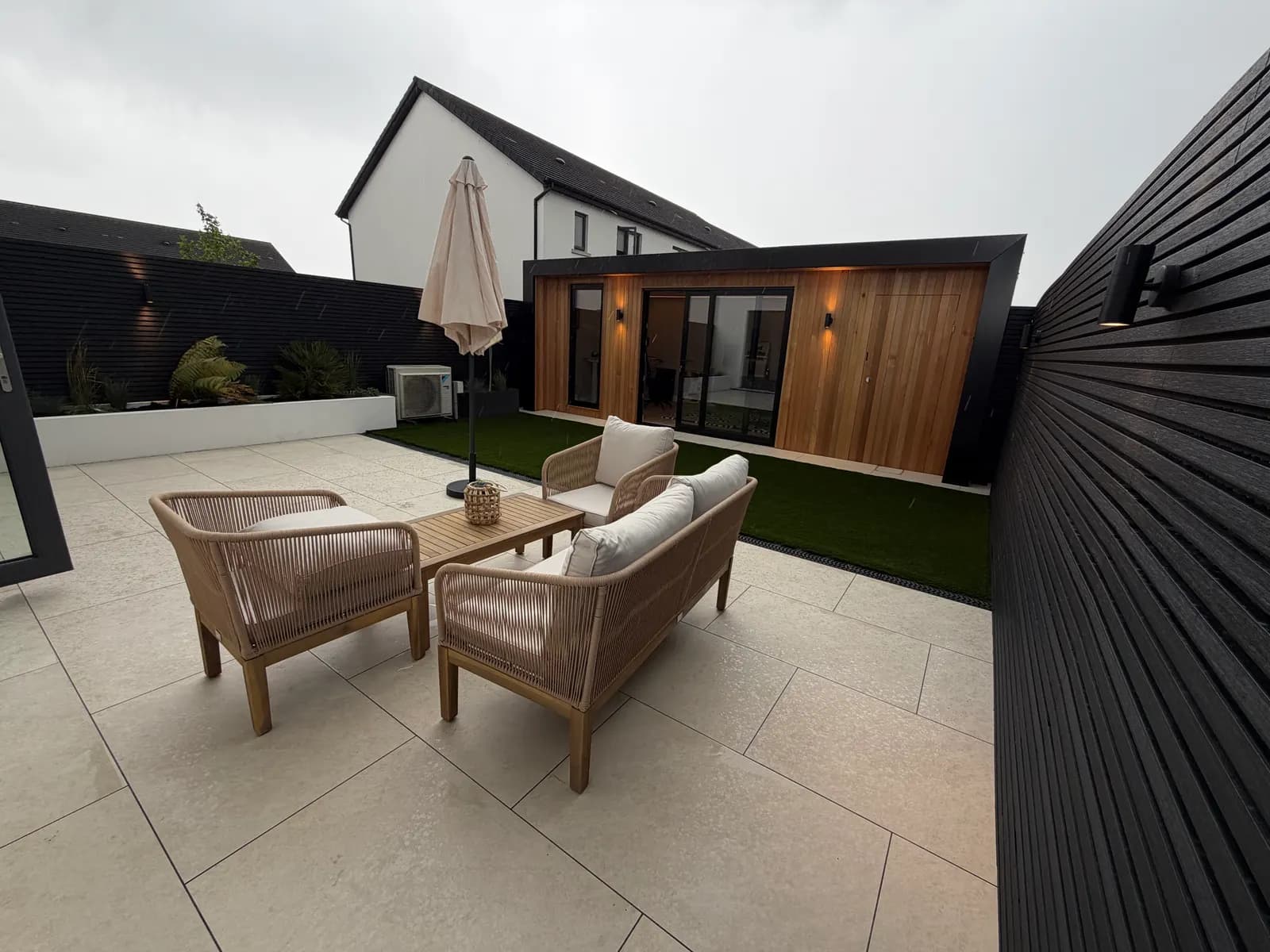 Luxury cedar garden room with porcelain patio seating area