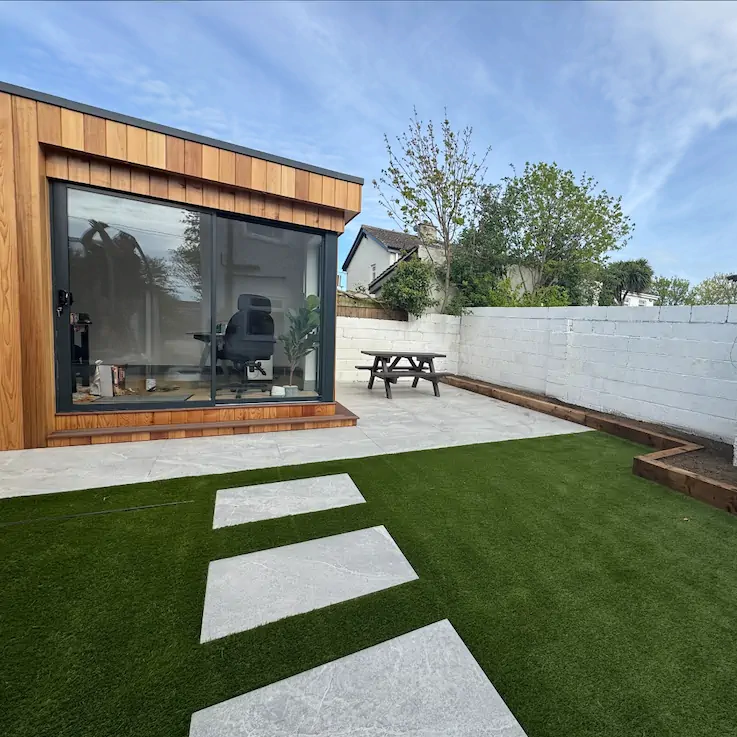 Artificial grass in a family garden with clean edging